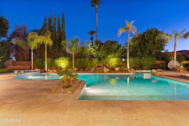 view of swimming pool featuring a patio and a fenced in pool