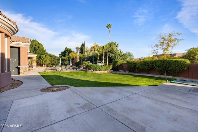 view of yard featuring a patio and fence