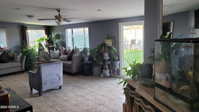 living room featuring light tile patterned flooring and ceiling fan