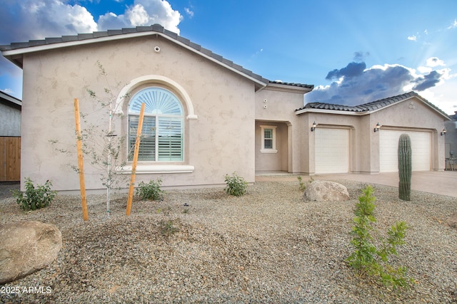 22665 E Stacey Rd, Queen Creek, AZ 85142 - view of front of house with an attached garage, stucco siding, driveway, and a tiled roof