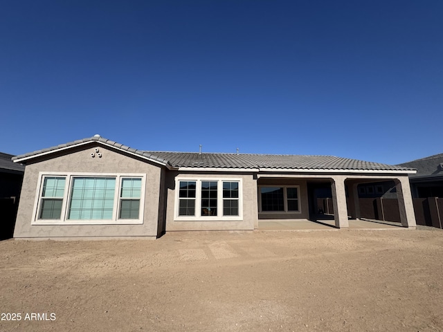 rear view of house featuring a patio