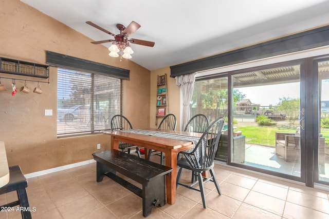 tiled dining space with ceiling fan