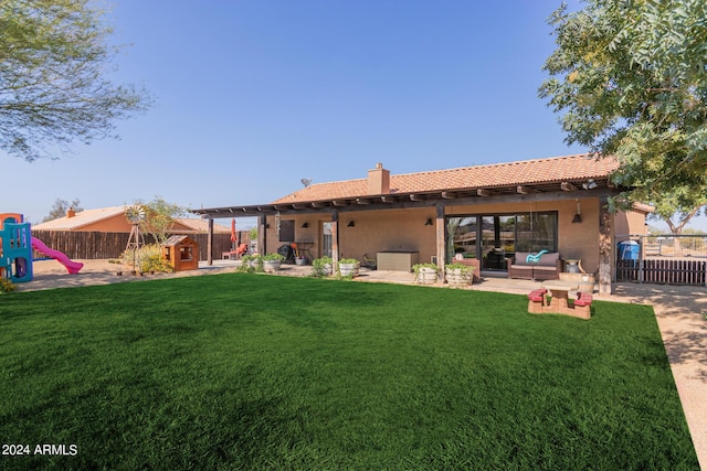 back of property featuring an outdoor living space, a yard, a playground, and a patio area