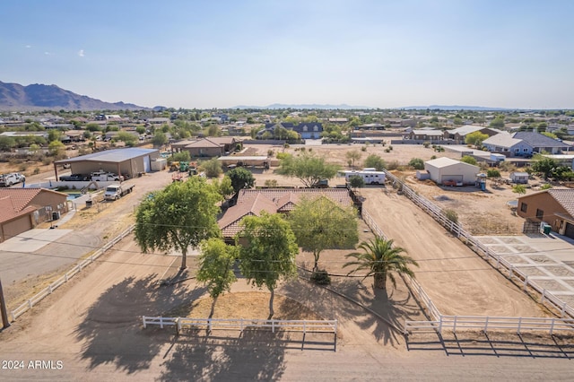 birds eye view of property with a mountain view