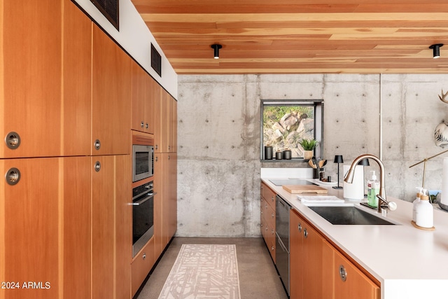 kitchen featuring appliances with stainless steel finishes, sink, and wooden ceiling