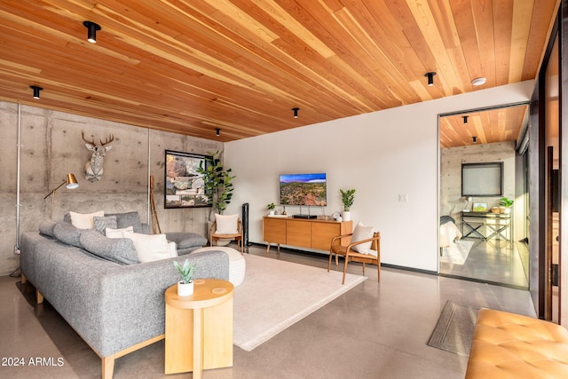 living room with concrete floors and wood ceiling