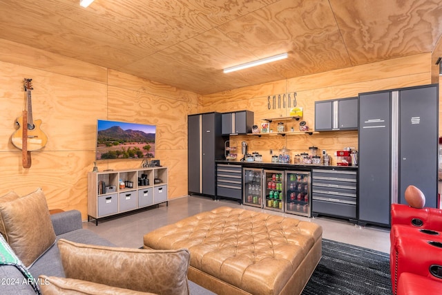 living room featuring bar and wooden ceiling