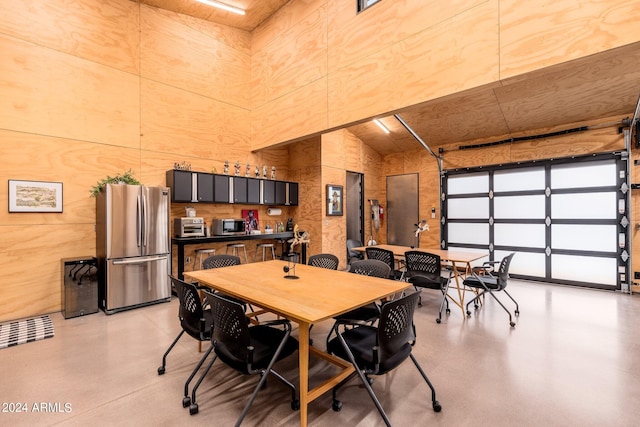 dining area with a high ceiling