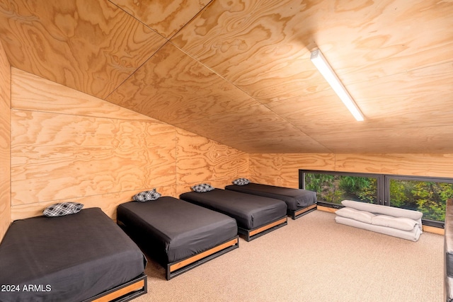 bedroom featuring wooden ceiling and carpet