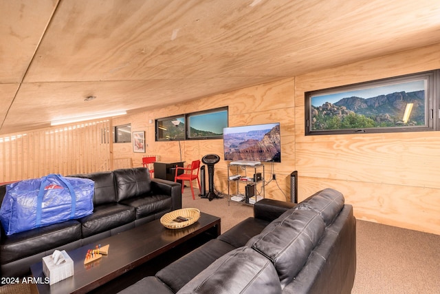 carpeted living room with wood ceiling