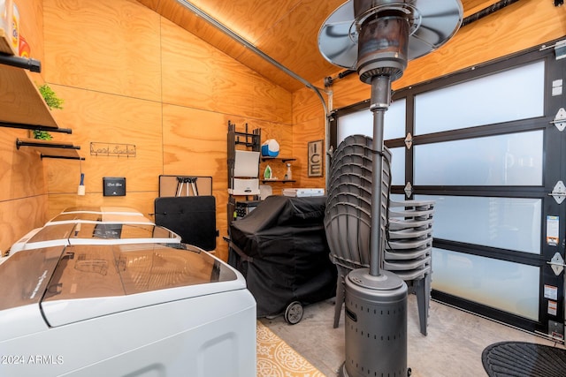 garage featuring washer / dryer and wood walls