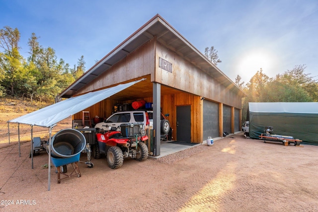 view of parking / parking lot with a garage