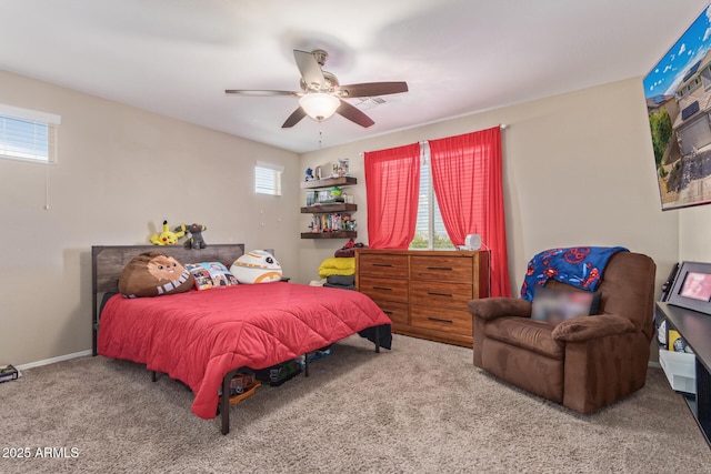 carpeted bedroom with a ceiling fan