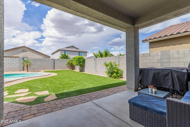 view of yard featuring a fenced backyard, a fenced in pool, and a patio area