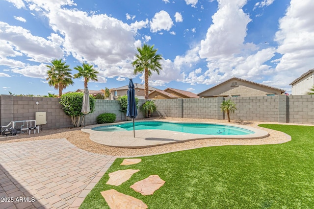 view of swimming pool featuring a fenced backyard, a fenced in pool, a patio, and a yard