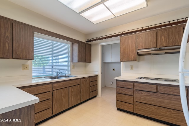 kitchen with sink and white electric stovetop