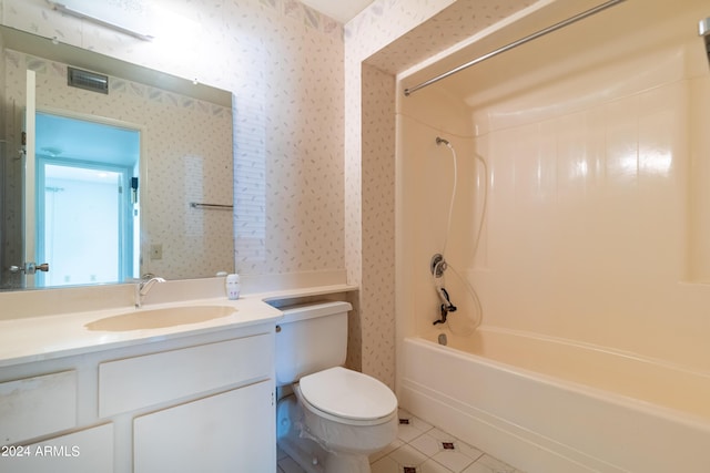 full bathroom featuring tile patterned flooring, toilet, vanity, and  shower combination