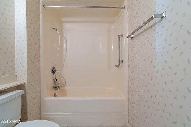 bathroom with shower / tub combination and toilet