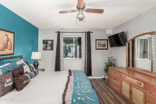 bedroom featuring ceiling fan, a textured ceiling, and dark hardwood / wood-style flooring