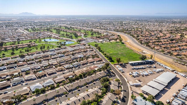 drone / aerial view with a water and mountain view