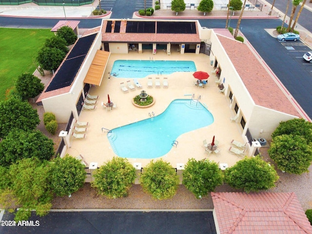 view of swimming pool with a patio area