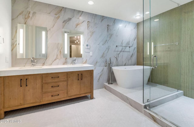 bathroom with vanity, plus walk in shower, and tile walls