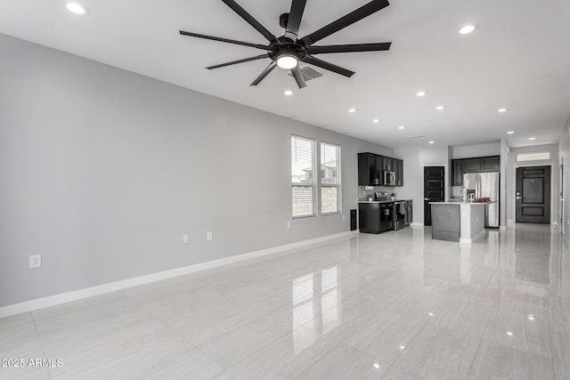 unfurnished living room featuring visible vents, recessed lighting, baseboards, and ceiling fan