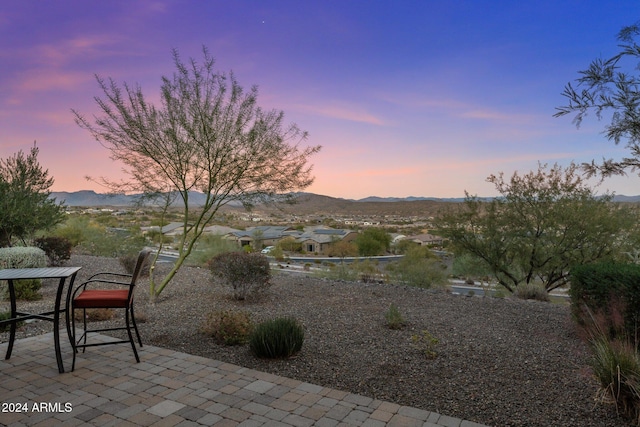 patio terrace at dusk with a mountain view