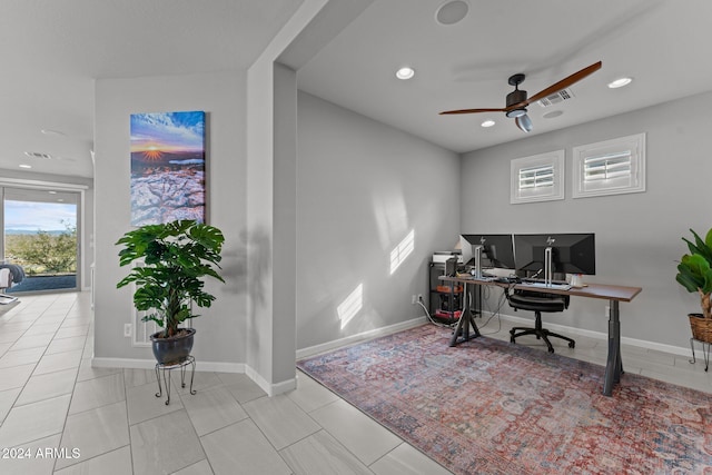 tiled office space with ceiling fan