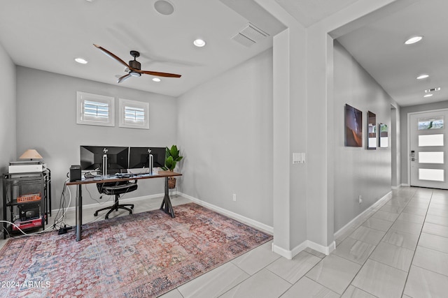 office with ceiling fan and light tile patterned floors