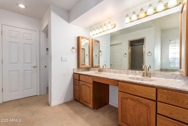 bathroom featuring walk in shower and vanity