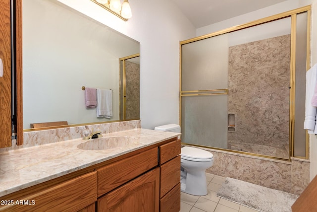 full bathroom with tile patterned floors, toilet, combined bath / shower with glass door, and vanity