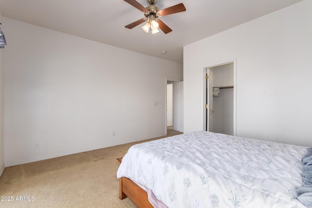 bedroom with ceiling fan and light carpet