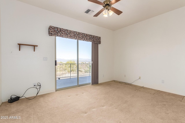 carpeted empty room with ceiling fan