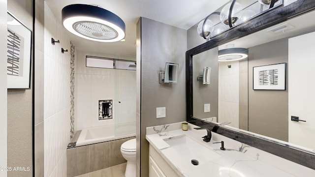 bathroom with  shower combination, visible vents, vanity, and toilet