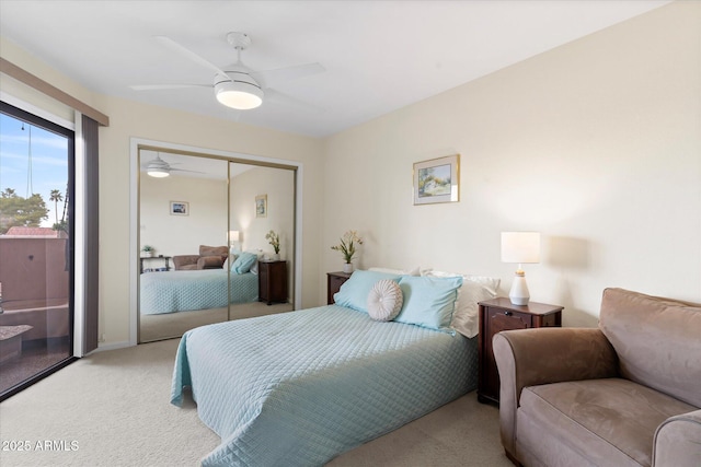 bedroom featuring light carpet, ceiling fan, and a closet