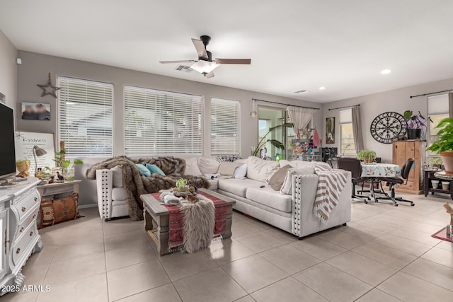 living room with light tile patterned floors, recessed lighting, visible vents, and ceiling fan