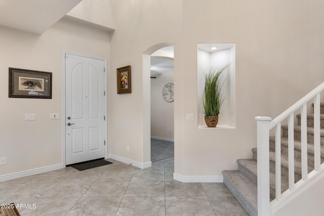 foyer with a towering ceiling