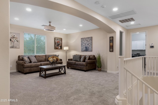 living room featuring light carpet