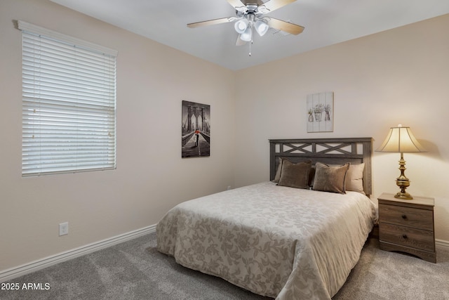 bedroom featuring ceiling fan and carpet