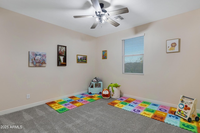 rec room featuring ceiling fan and carpet floors