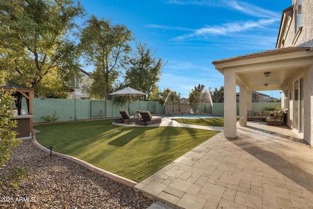 view of yard with outdoor lounge area and a patio area