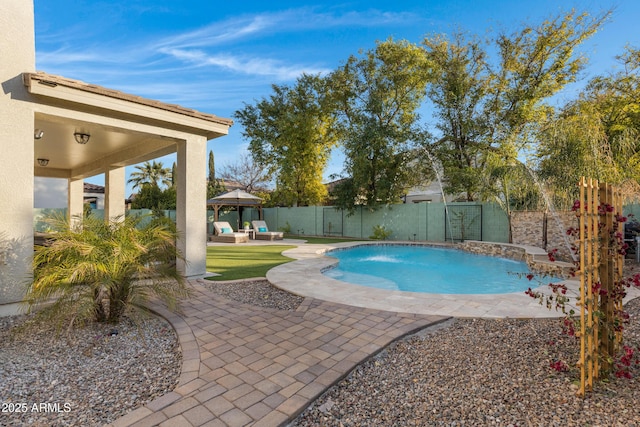 view of swimming pool featuring a gazebo, pool water feature, and a patio