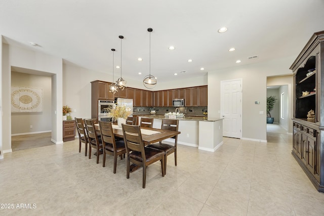 2727 S Balboa Dr, Gilbert, AZ 85295 - dining room featuring recessed lighting, light tile patterned floors, and baseboards