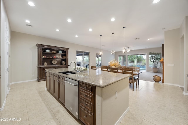 2727 S Balboa Dr, Gilbert, AZ 85295 - kitchen featuring stainless steel dishwasher, a sink, light tile patterned floors, recessed lighting, and a kitchen island with sink