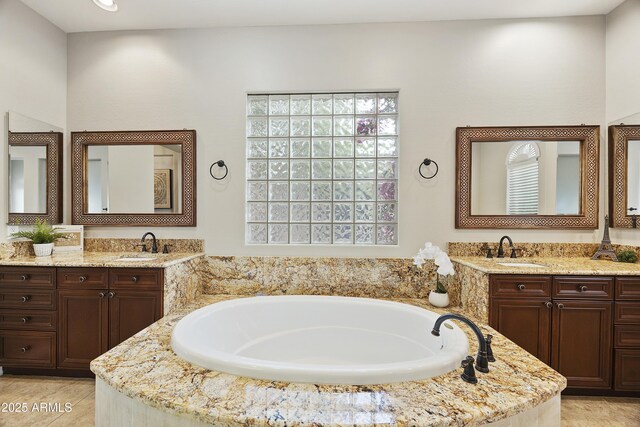 2727 S Balboa Dr, Gilbert, AZ 85295 - bathroom featuring two vanities and a garden tub