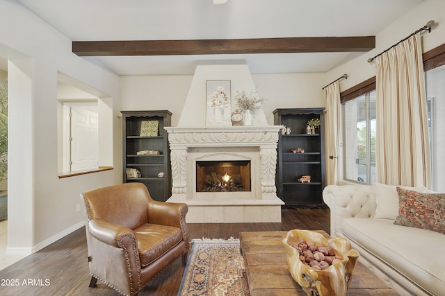 2727 S Balboa Dr, Gilbert, AZ 85295 - living room featuring dark wood-style flooring, baseboards, beamed ceiling, and a premium fireplace