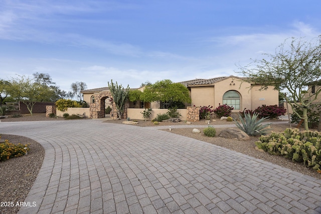 2727 S Balboa Dr, Gilbert, AZ 85295 - mediterranean / spanish-style house featuring stucco siding, curved driveway, fence, and a tile roof