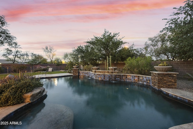 2727 S Balboa Dr, Gilbert, AZ 85295 - pool at dusk featuring a fenced backyard