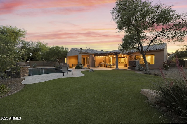 2727 S Balboa Dr, Gilbert, AZ 85295 - back of house at dusk featuring stucco siding, a patio area, and a tiled roof